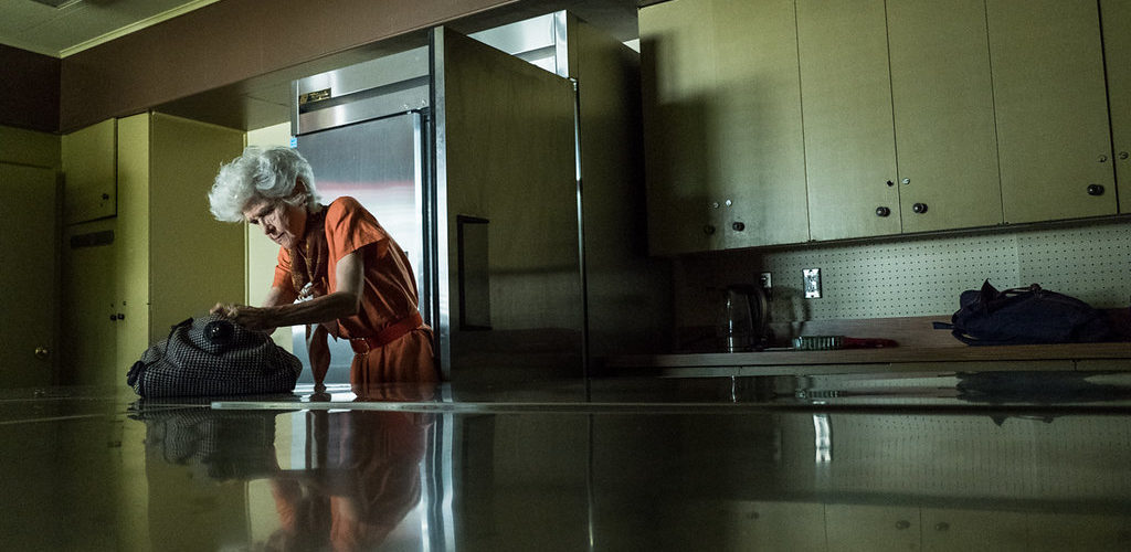 Wilma searches for something in the kitchen of Ambrosia Manor